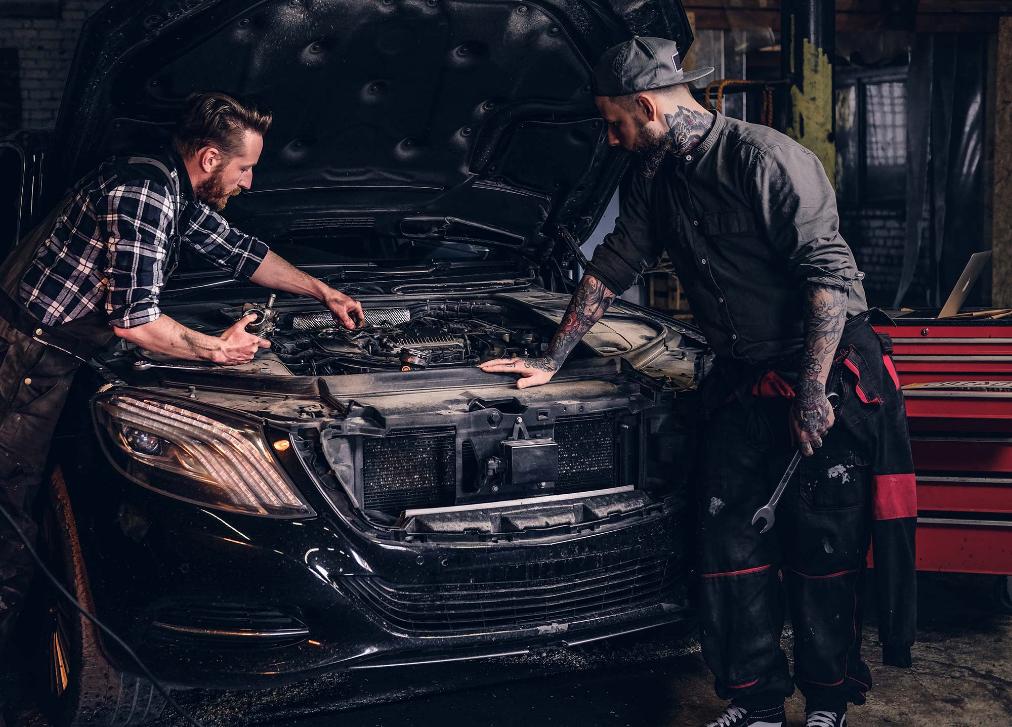 two-bearded-auto-mechanic-working-in-repair-garage-small.jpg